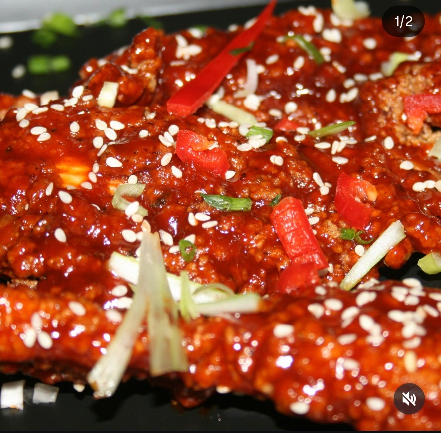 Sticky sesame glazed chicken with chilli and spring onion