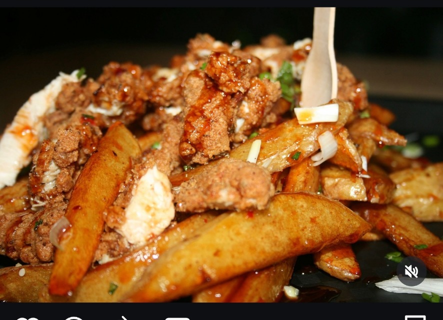 Messy loaded fries piled with crispy chicken pieces, melted cheese & sauce