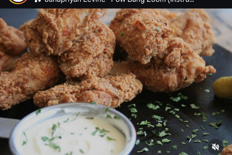 Share box loaded with crispy wings, tenders and creamy dip