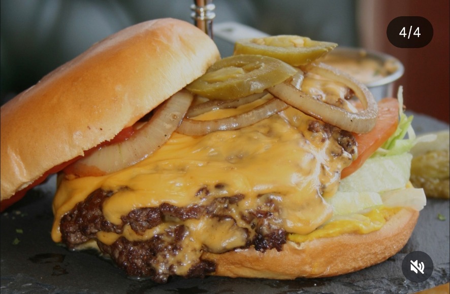 Double smash burger with American cheese, jalapeños & onions